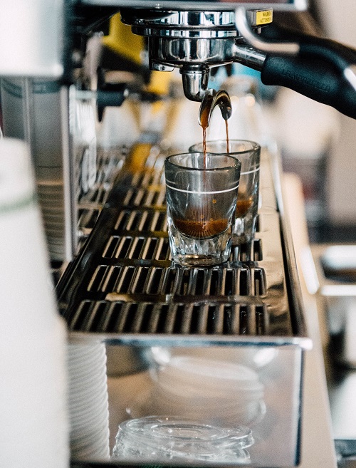 an espresso machine serves espresso