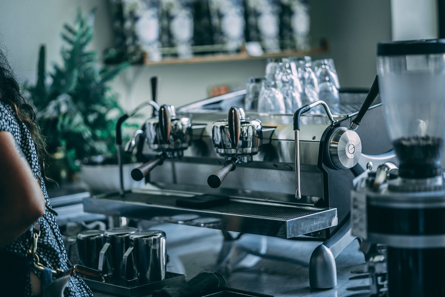 an espresso machine is ready to serve coffee