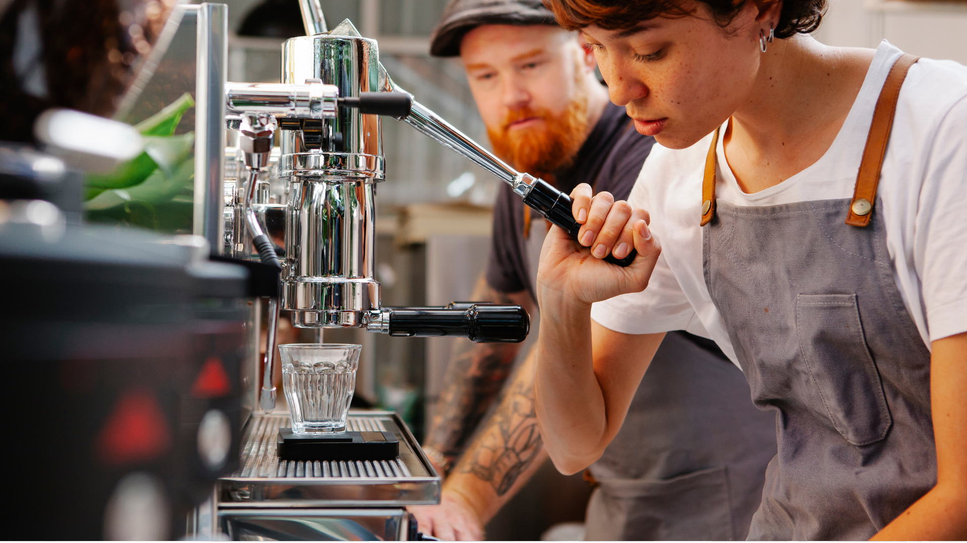 A barista extracts an espresso shot for a mobile coffee business.
